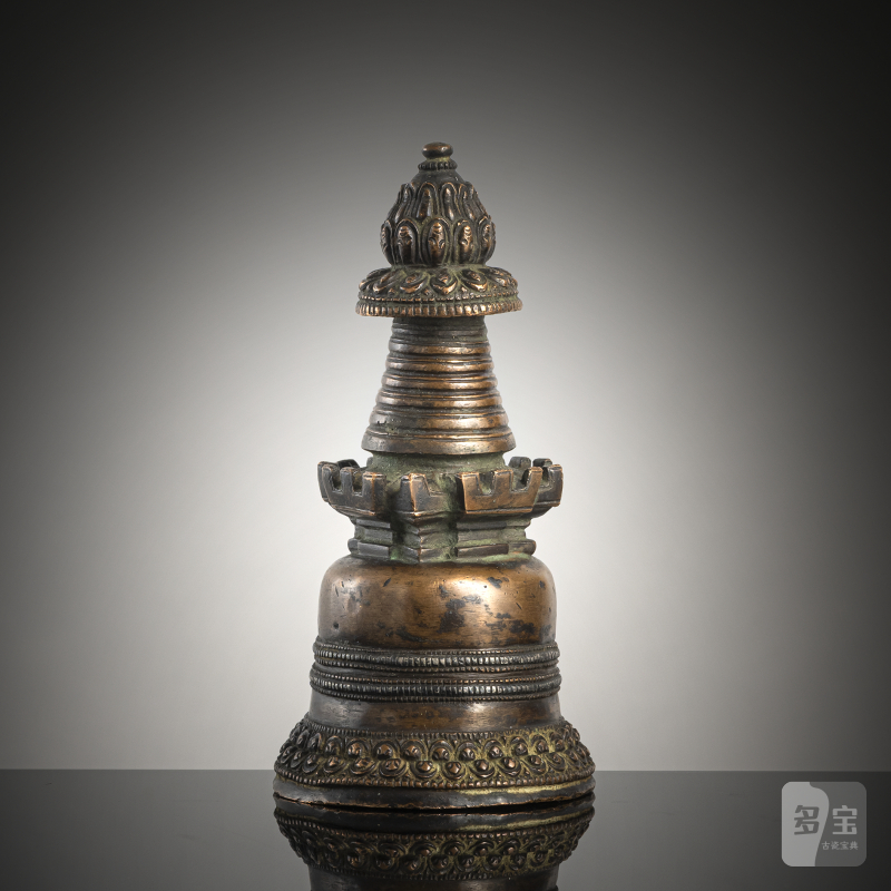 A COPPER STUPA WITH SILVER INLAYS